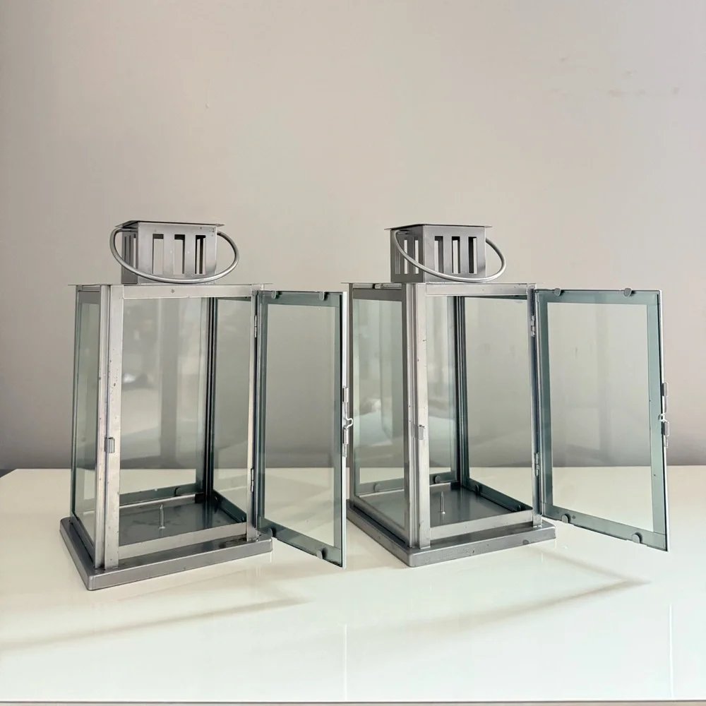 Metal and glass rustic lantern for candles, with safety lock and handle.Set two